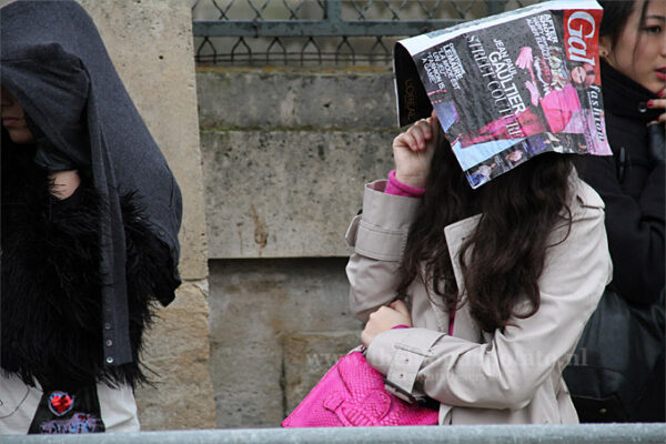 Regen. Fashionista's onder de paraplu